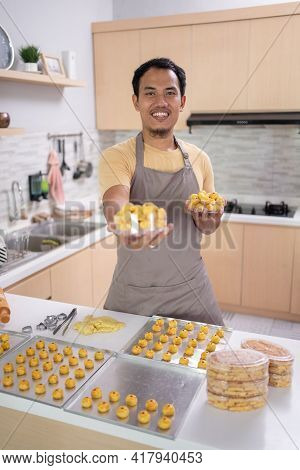 Asian Young Man With His Cooking Smiling