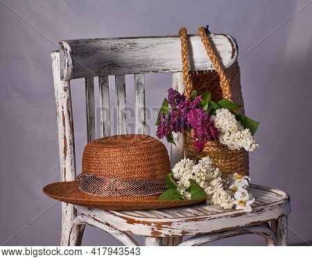 Stillife With Lilak Flowers And Hat On Vintaje Cher