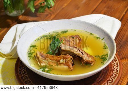 Smoked Ribbs Soup With Potato, Dill And Red Lentils, Selective Focus