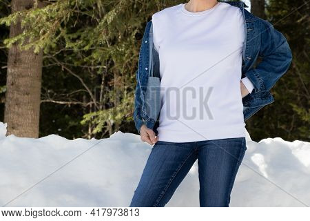 White Sweatshirt Mockup Of A Girl  In Snowy Winter Forest, Model Mockup
