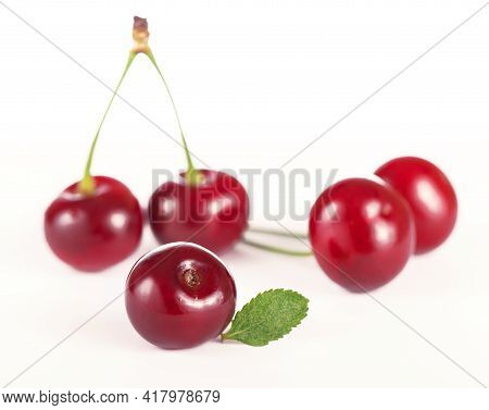 Ripe Fresh Red Cherry Isolated On White Background.