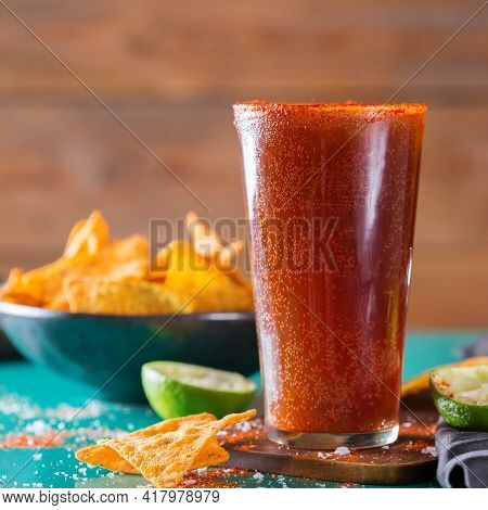 Mexican Alcohol Cocktail Michelada With Dark Beer And Lime Juice