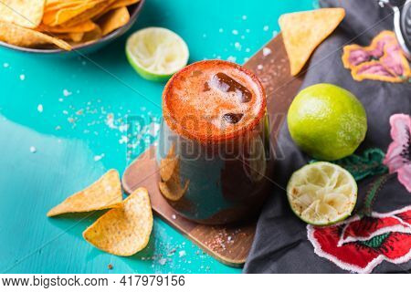 Mexican Alcohol Cocktail Michelada With Dark Beer And Lime Juice