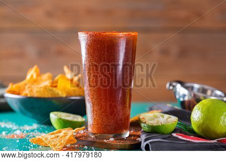 Mexican Alcohol Cocktail Michelada With Dark Beer And Lime Juice