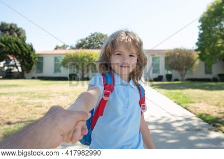 Back To School, Lovely Schoolboy Holding Parent Fathers Hand On The Way To The School. Concept Of Pr