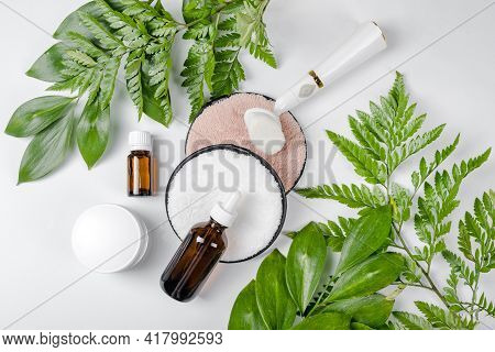 Organic Bio Cosmetics With Herbal Ingredients. Natural Extract, Oil, Serum With Fresh Leaves. Flat L