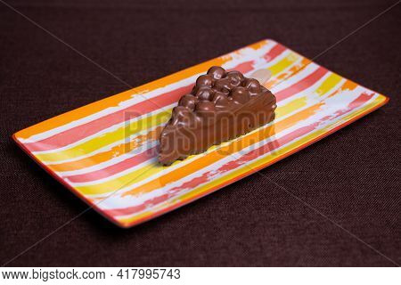 Children's Chocolate Dessert On A Bright Plate.