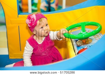 Happy Baby Girl  Keep On Board Ship On Playground  The Concept Of Childhood And Holiday