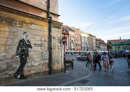 KRAKOW, POLAND - SEPTEMBER 8:  One of the streets in historical center, September 8, 2013 in Krakow, Poland. This year the city was visited by more 8.1 million tourists, which is the highest level.