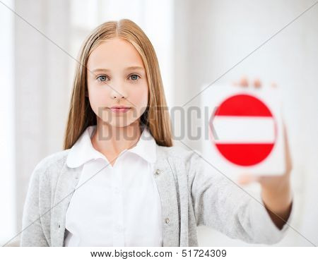 education, school and anti-bullying concept - student girl showing no entry sign