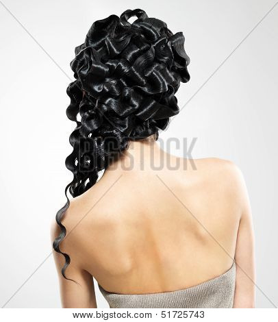 Back View Of  A Woman With Fashoin Curly Hairstyle