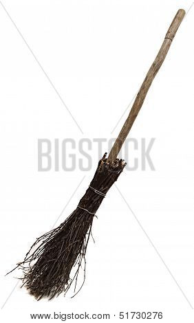 Old wicked broom isolated on white.