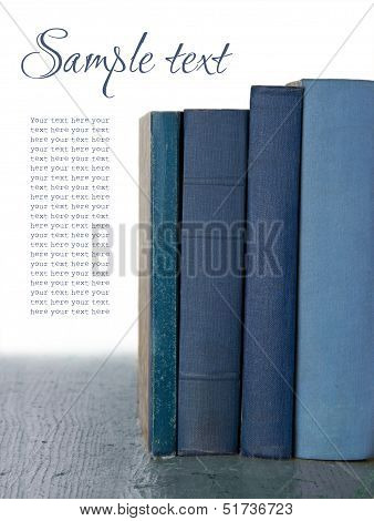 Blue Old Books On Wooden Background