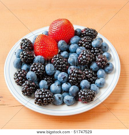 Small Plate With Fresh Summer Berries - Strawberry, Blueberry And Blackberry.