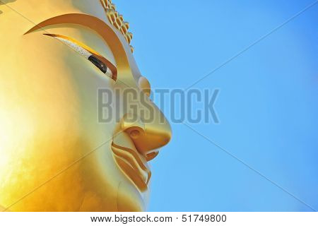 Golden monk and blue sky