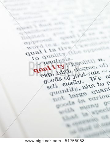 The word 'quality' highlighted in a dictionary