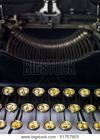 Close up of a vintage typewriter isolated on white background