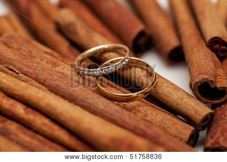 two golden wedding rings on canella