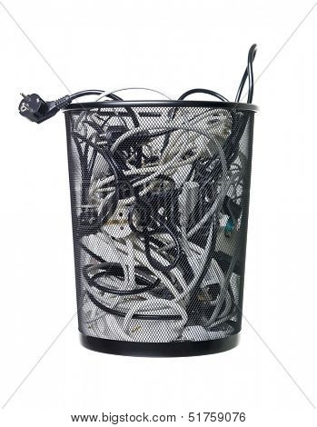 Electric wires in a wastebasket isolated on white background