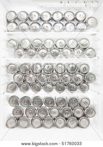 Several beer cans in the Refrigerator