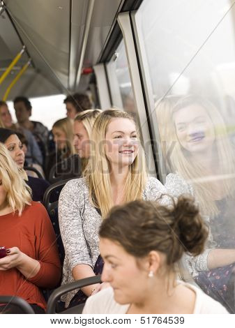 Happy woman on the bus