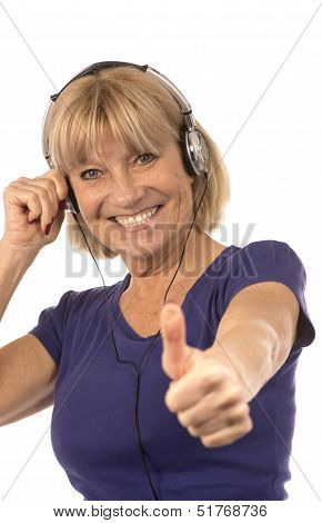 Senior Woman 50-60Years Listening To Music With Stereo Headphones On White.
