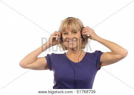 Senior Woman 50-60Years Listening To Music With Stereo Headphones On White.