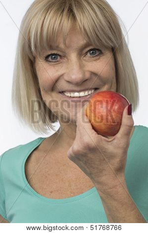 Sporty Woman With A Red Apple Senior