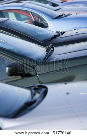 Large group of Parked Cars in a row