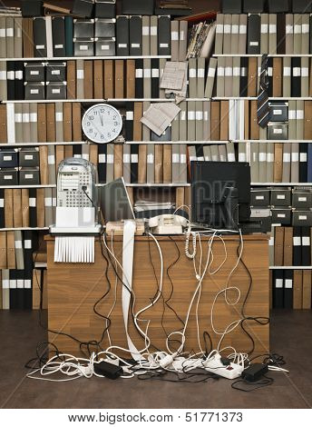 Overloaded desk at a messy office