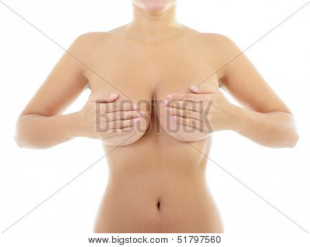 Body of beautiful woman covering her breast, over white
