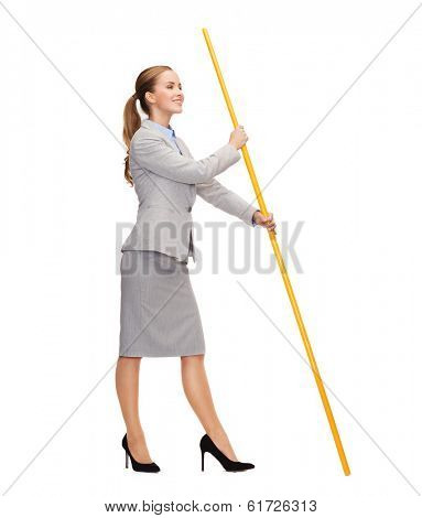 business and advertisement concept - smiling woman holding flagpole with imaginary flag