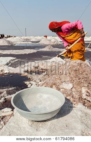 SAMBHAR, INDIA - NOVEMBER 19, 2012: Women mining salt at lake Sambhar, Rajasthan, India. Sambhar Salt Lake is India's largest inland salt lake