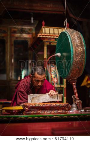DISKIT, INDIA - SEPTEMBER 12, 2012: Unidentified Tibetan Buddhist monk praying in Hemis gompa, Ladakh