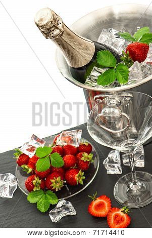 Festive Arrangement With Bottle Of Champagne And Strawberries