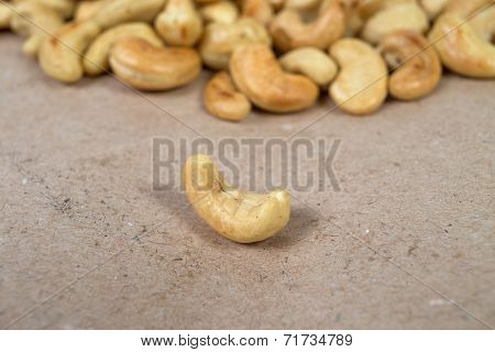 One Roasted Cashew And Cachews On Background