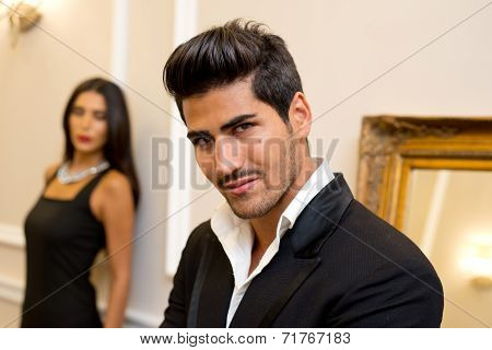 Fashionable male and female model in an elegant setting