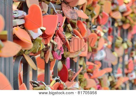The Key To Hundreds Of Old Symbol Of Love . Locked To The Rack -focus Blur.