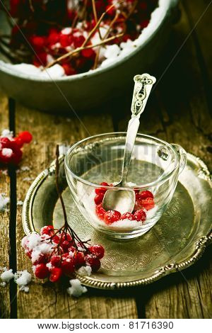 Fresh Berries Of A Guelder-rose In A Glass Cup On A Wooden Table.