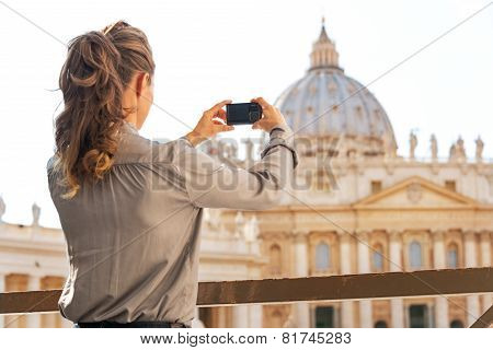 Young Woman Taking Photo Of Basilica Di San Pietro In Vatican Ci