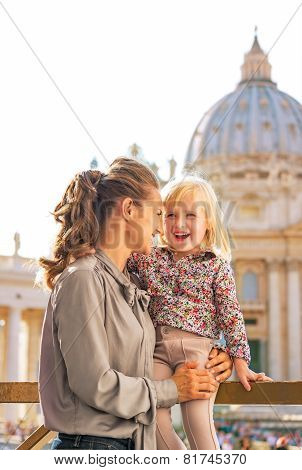 Portrait Of Happy Mother And Baby Girl In Front Of Basilica Di S