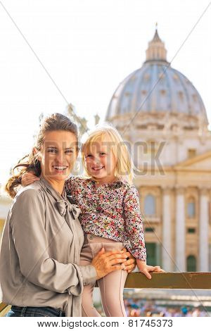 Portrait Of Happy Mother And Baby Girl In Front Of Basilica Di S