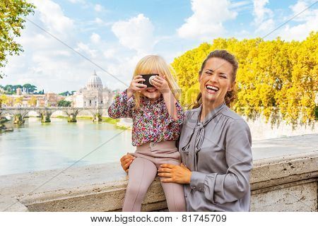 Happy Mother And Baby Girl With Photo Camera On Bridge Ponte Umb