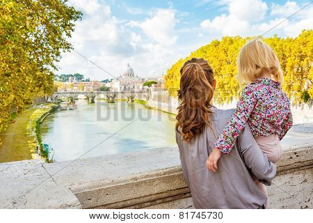Happy Mother And Baby Girl Sightseeing On Bridge Ponte Umberto I