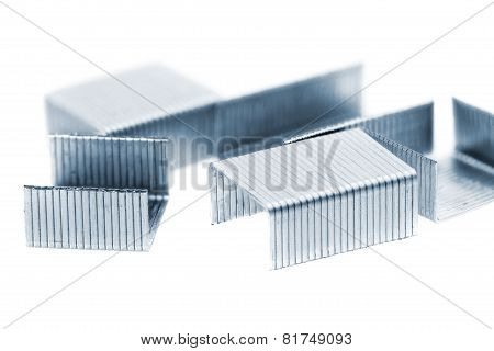 Stack Of Metal Staples. Isolated On A White.