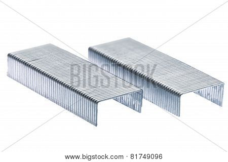 Stack Of Metal Staples. Isolated On A White.