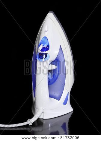 Electric Iron On Black Background.