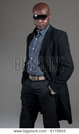 Happy Black Man Well Dressed Smiling On Gray Background