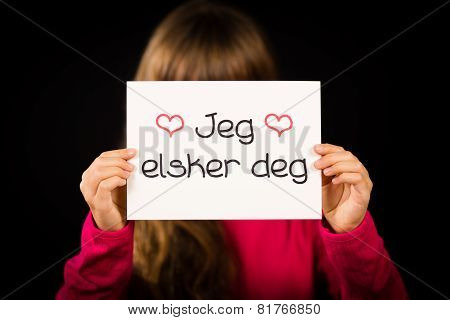 Child Holding Sign With Norwegian Words Jeg Elsker Dig - I Love You