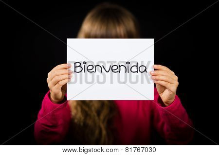 Child Holding Sign With Spanish Word Bienvenida - Welcome